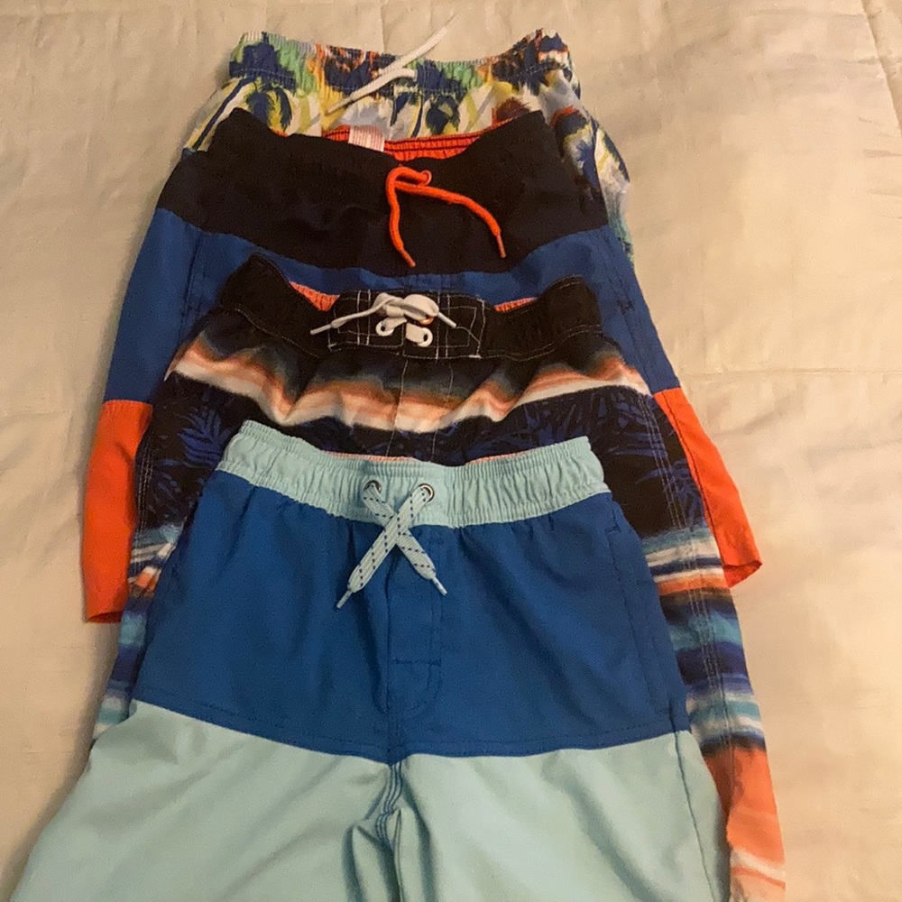 4 pair of boys swim trunks, size small.